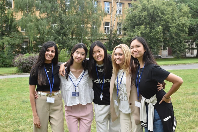 Students together on a campus lawn